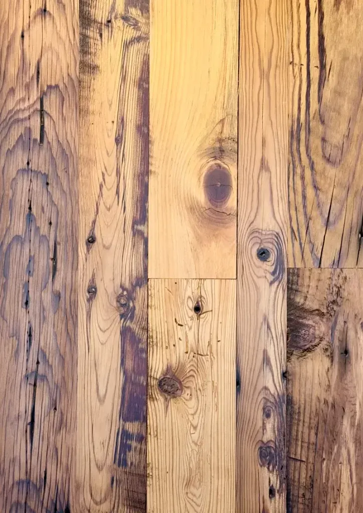 Reclaimed wood flooring detail of antique pine with rustic saw marks and heritage patina. Milled in Virginia by Appalachian Woods. High-quality wide plank flooring for luxury residential architecture and modern farmhouse design.